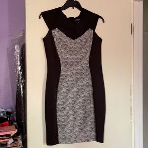 Nice dinner dress. Has been worn. Small opening details around chest/neck area.
